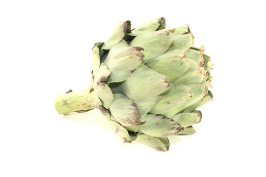 fresh green Artichoke on a light background