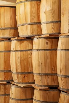 new wooden barrels background - a storage concept