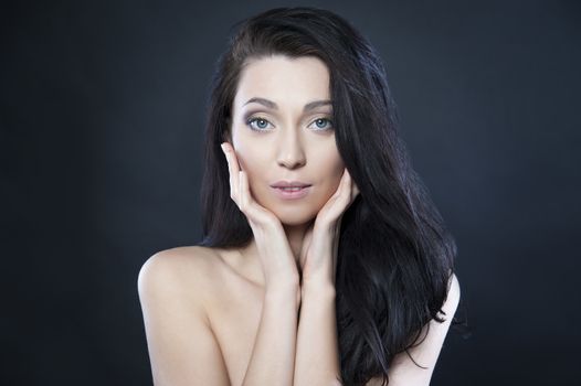 beautiful woman with blue eyes on a black background