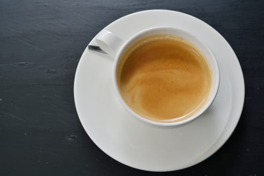 Espresso coffee on black table