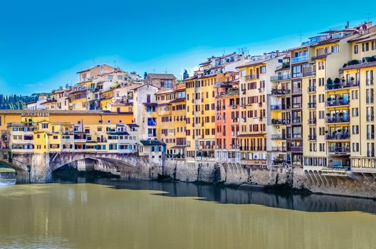 View of colorful houses and Ponte Vecchio bridge in Florence, Italy