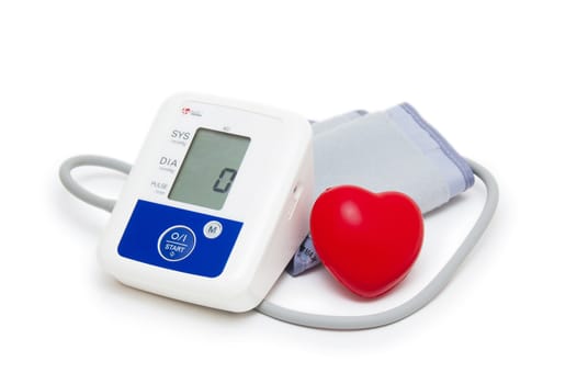 Digital blood pressure meter with love heart symbol on white background 