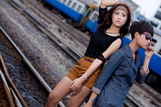 fashion portrait asian two girl in train station.portrait fashion on outdoor.