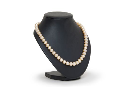 Pearl necklace on black mannequin isolated 