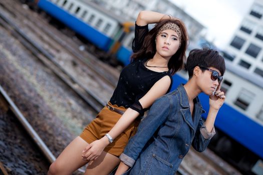 fashion portrait asian two girl in train station.portrait fashion on outdoor.