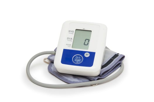 Digital blood pressure meter with love heart symbol on white background 