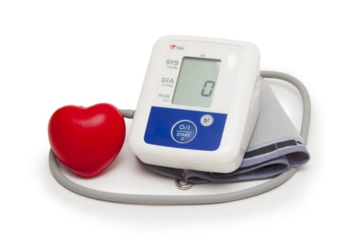 Digital blood pressure meter with love heart symbol on white background 