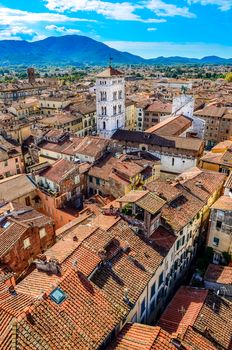 Scenic vertical view of Lucca colorful village from Torre delle Ore, Lucca, Italy