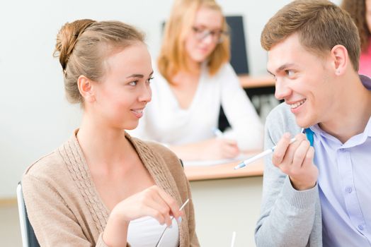 image of a two students in the class talk