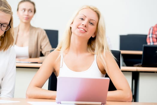 portrait of young female student in the classroom, teaching at the University of