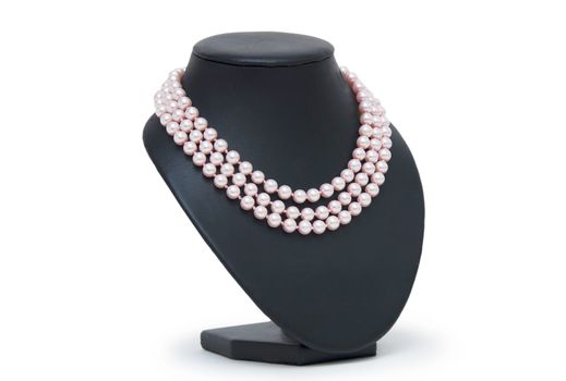 Pearl necklace on black mannequin isolated