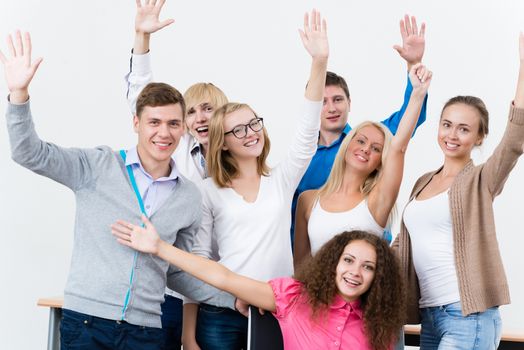 University students in the class raised their hands and having fun