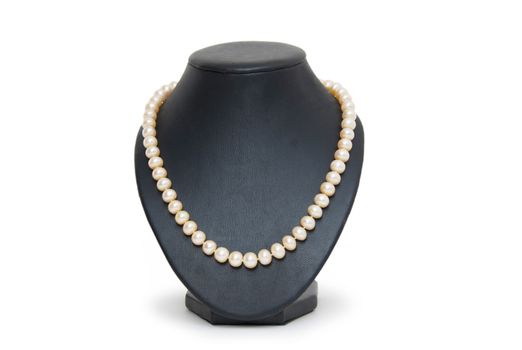 Pearl necklace on black mannequin isolated 