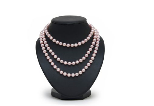 Pearl necklace on black mannequin isolated 