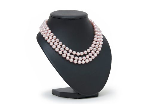 Pearl necklace on black mannequin isolated 