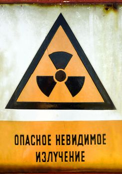 Radioactivity sign on a shelter door closeup