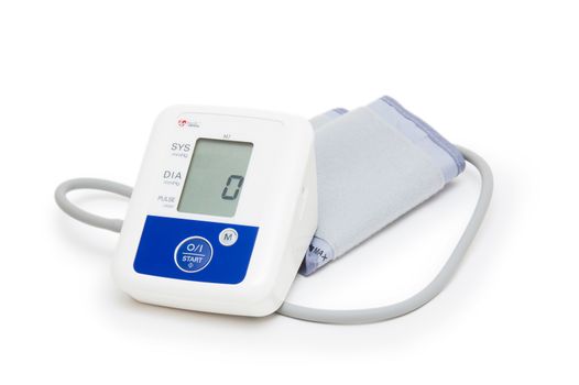 Digital blood pressure meter with love heart symbol on white background 