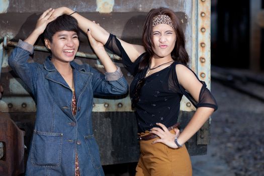 fashion portrait asian two girl in train station.portrait fashion on outdoor.