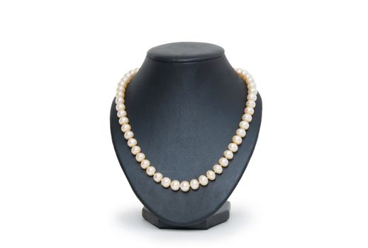 Pearl necklace on black mannequin isolated 