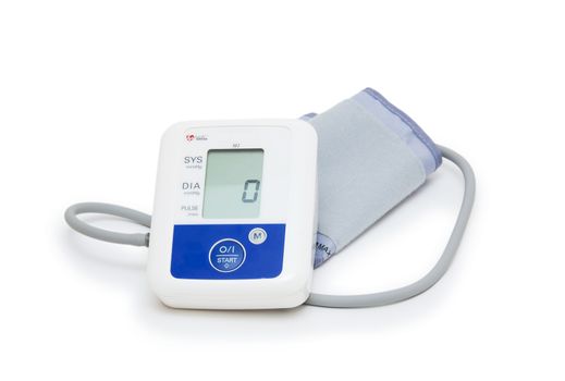 Digital blood pressure meter with love heart symbol on white background 