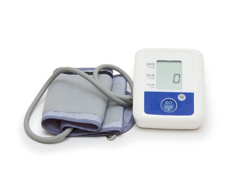 Digital blood pressure meter with love heart symbol on white background 