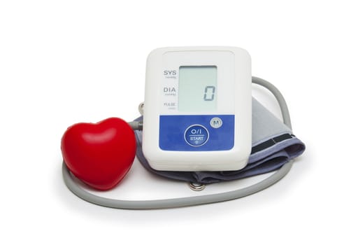 Digital blood pressure meter with love heart symbol on white background 