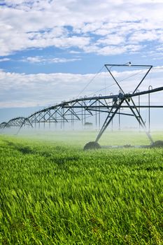 Industrial irrigation equipment on farm field in Saskatchewan, Canada