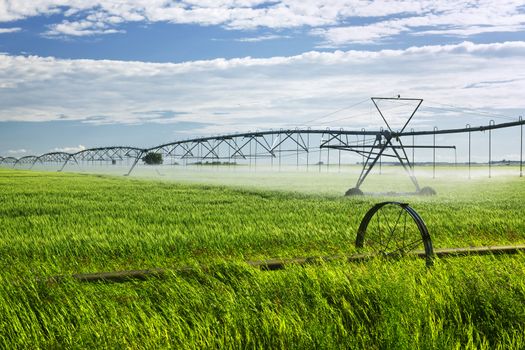 Industrial irrigation equipment on farm field in Saskatchewan, Canada