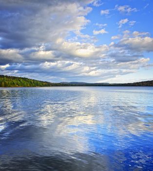 Lake of Two Rivers reflecting blue sky and clouds in Algonquin Park, Canada