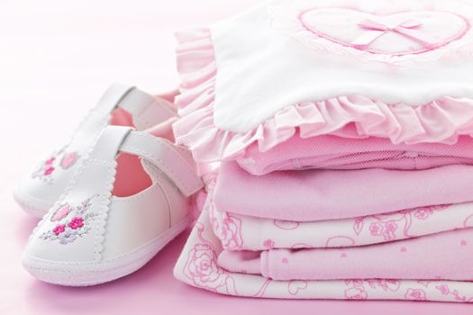 Pink infant girl clothing and shoes for baby shower