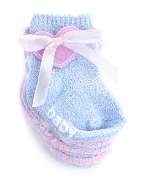 Pink and blue infant socks for baby shower with ribbon