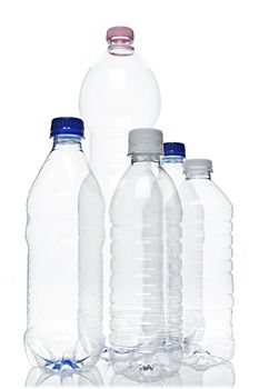 Assorted clear empty plastic recyclable bottles isolated on white