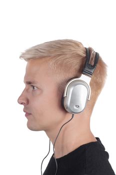 Guy in headphones isolated on white, photo in profile