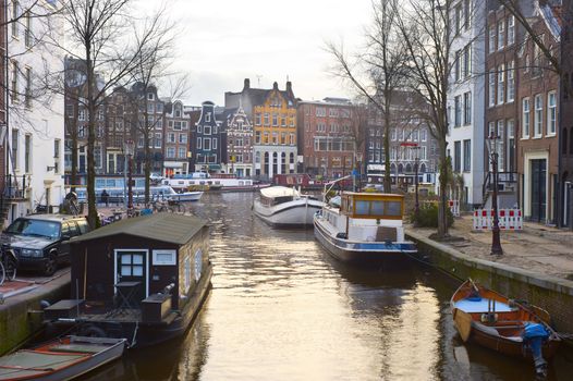 Amsterdam downtown and channel in sunset light