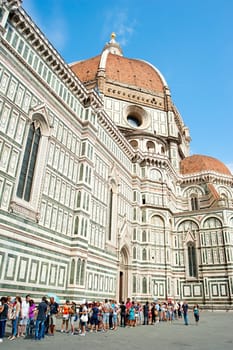 FLORENCE, ITALY - SEPR 08, 2013: People waiting in queue at Cathedral Santa Maria del Fiore in Florence. With r46.1 million tourists a year, Italy is the fifth most visited country in the world
