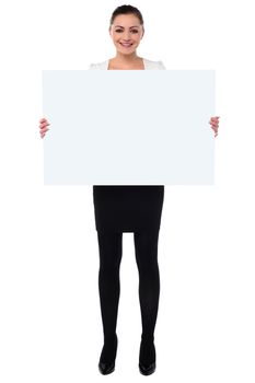 Young woman holding blank whiteboard