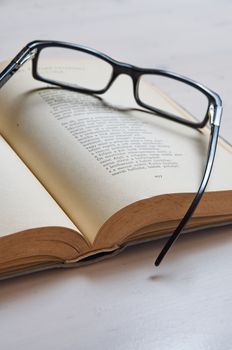 Reading glass on an old book