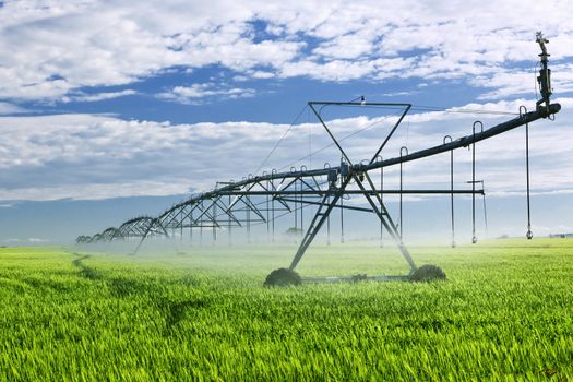 Industrial irrigation equipment on farm field in Saskatchewan, Canada