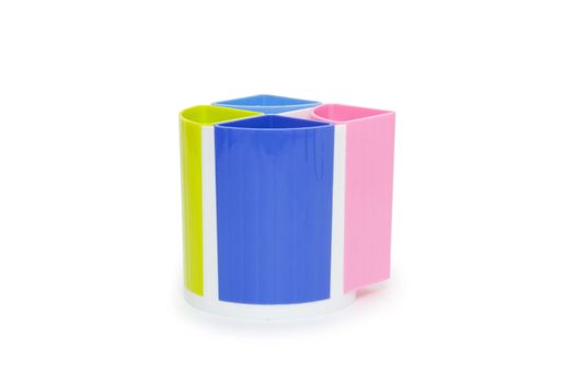 Colorful pencil holder isolated on white