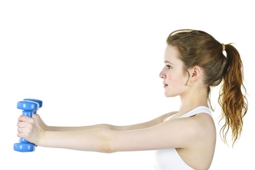 Determined healthy fit young woman lifting weights for fitness exercise