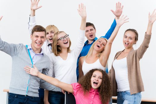 University students in the class raised their hands and having fun