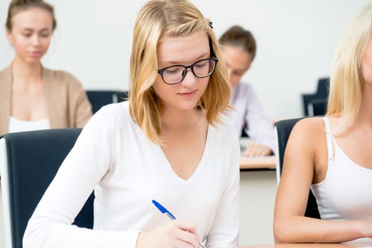 portrait of young female student in the classroom, teaching at the University of