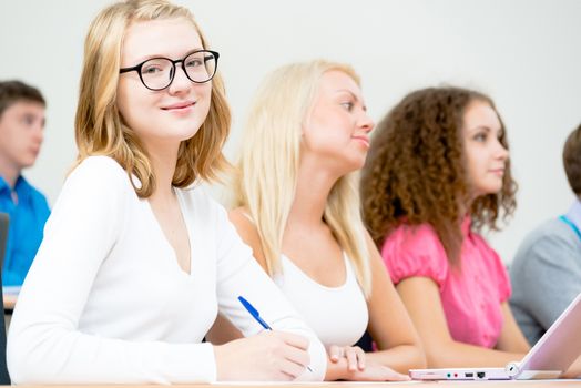 image of a young female students in the classroom, teaching at the University of