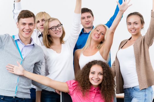 University students in the class raised their hands and having fun