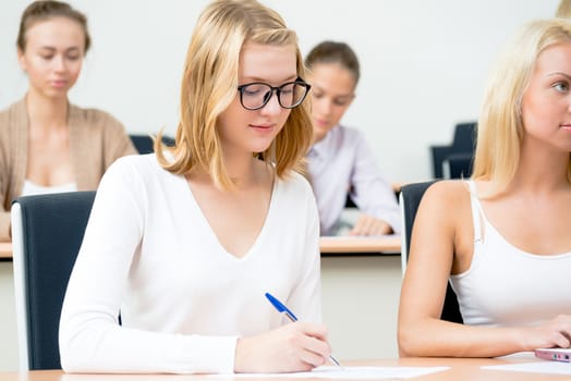 portrait of young female student in the classroom, teaching at the University of