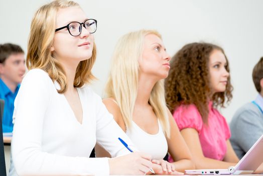 image of a young female students in the classroom, teaching at the University of