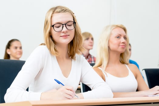 image of a young female students in the classroom, teaching at the University of