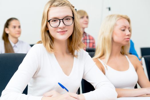 image of a young female students in the classroom, teaching at the University of