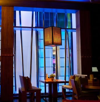 interior of the cafe in Japanese style with a lantern above the table, the high ISO