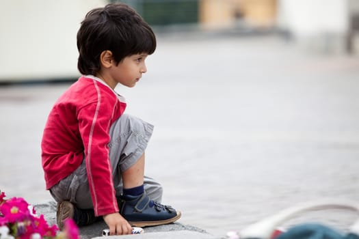 little boy in a red T-shirt